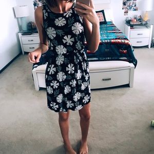 Low V back dress with black  floral pattern.